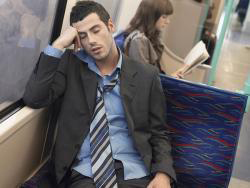 Male sleeping on a train in Scottsdale, AZ due to sleep apnea 