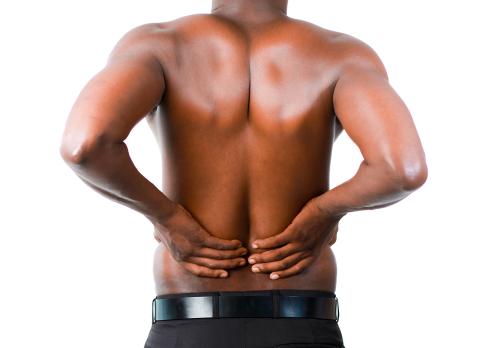 man has lower back pain in Omaha, NE