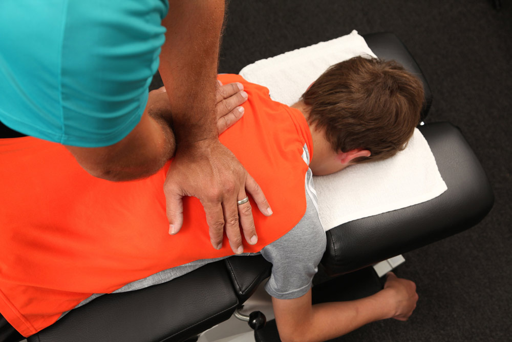a person getting Chiropractic Adjustments