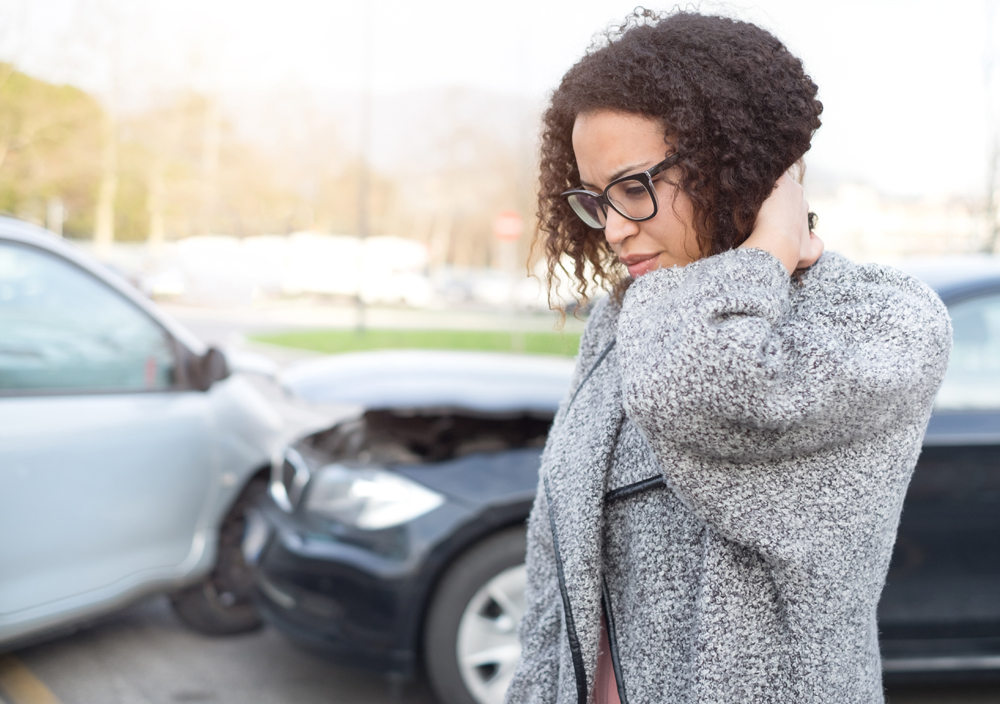 Woman suffering from a whiplash injury after an auto accident