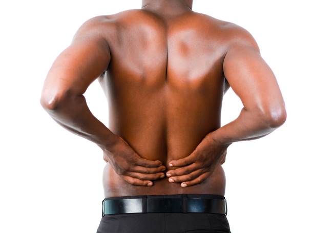 man with lower back pain needs a car accident chiropractor