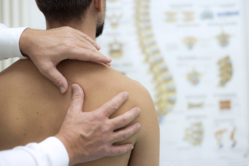 patient needing chiropractic shoulder pain relief in Knoxville