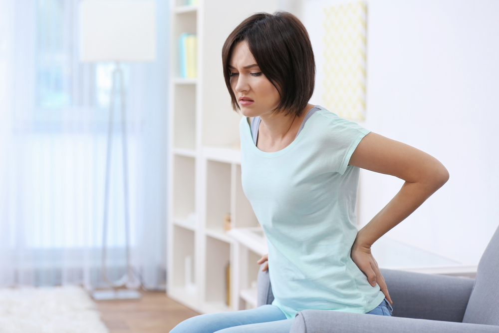 woman suffering from a painful degenerative disc disease