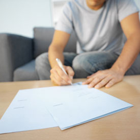 Person completing paperwork.