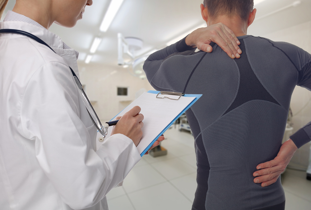 Chiropractor treating an athlete for a sports injury