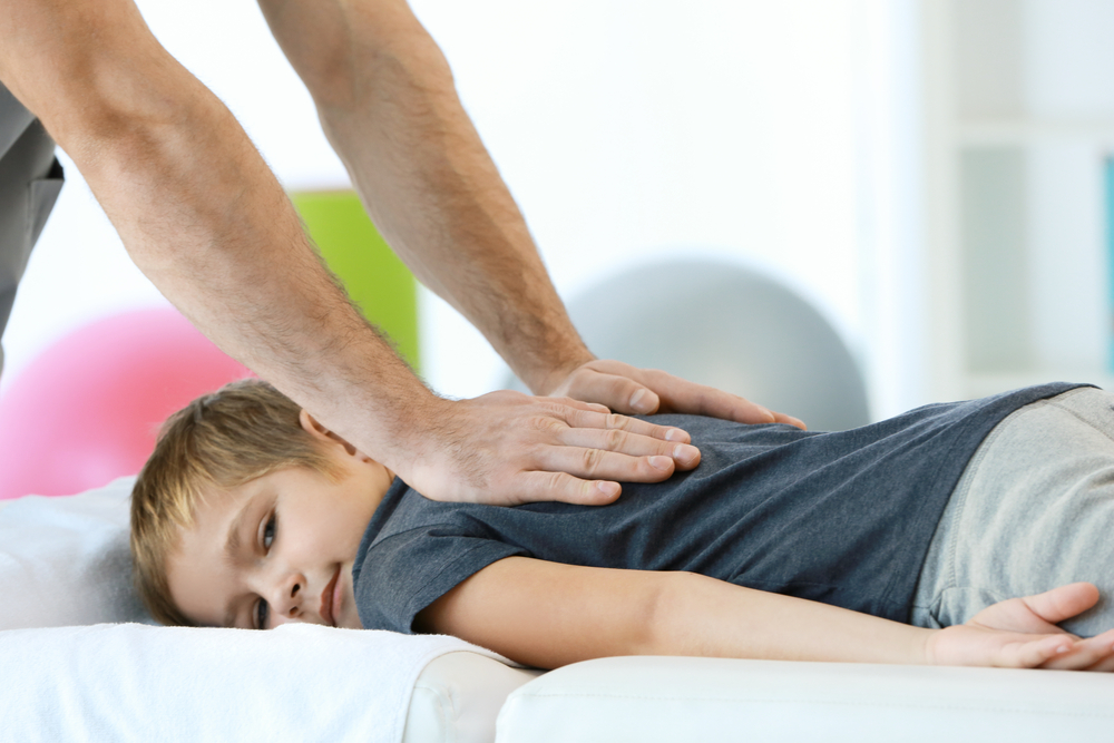 Boy getting pediatric chiropractic care from his chiropractor in Portsmouth, NH.