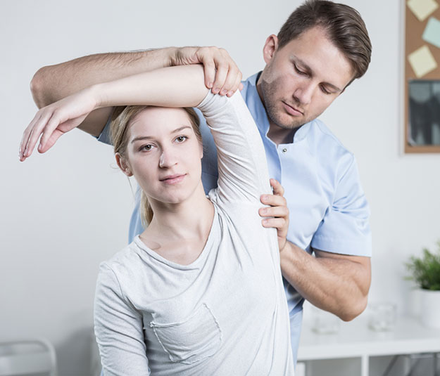 Chiropractor adjusting woman