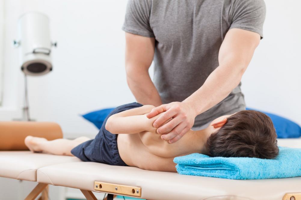 pediatric chiropractor providing a chiropractic adjustment for kids