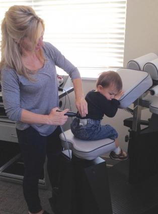 Chiropractor in Winchester making spinal adjustments to help pain