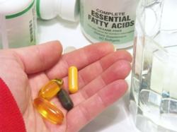 Female holding vitamins in Garland, TX for bioidentical hormone therapy