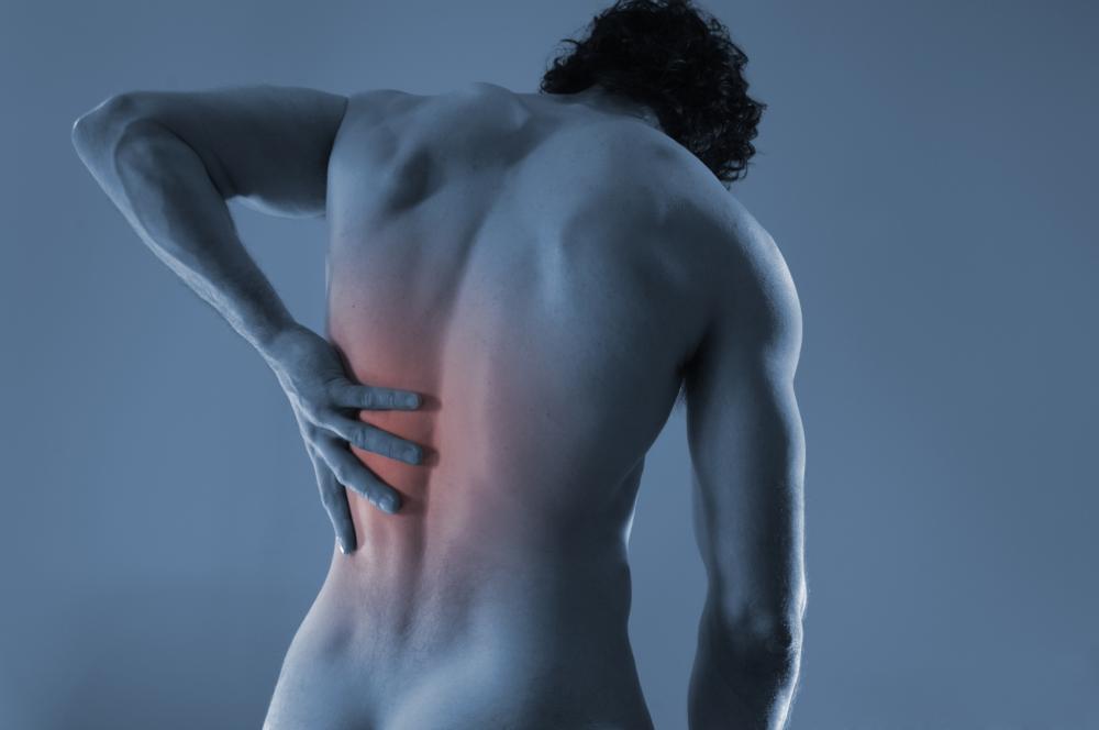 man with hand on his back from back pain.
