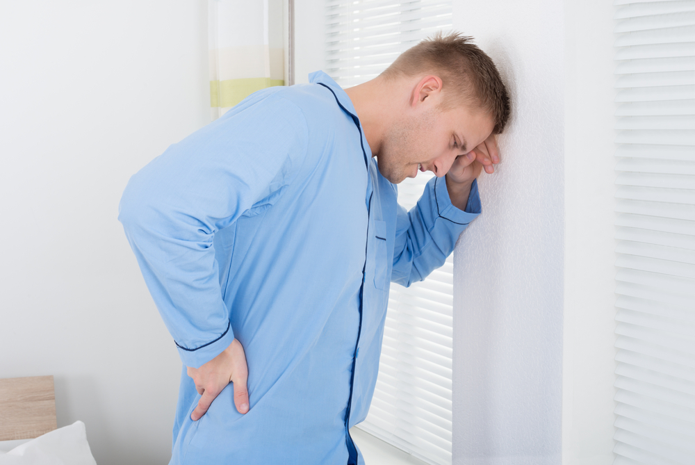 man with back pain in Livonia