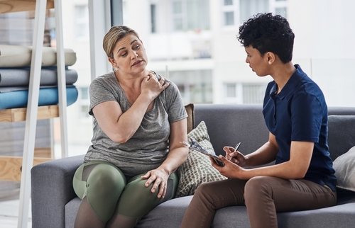 woman complaining about her shoulder