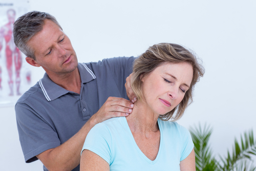 woman getting neck adjustment