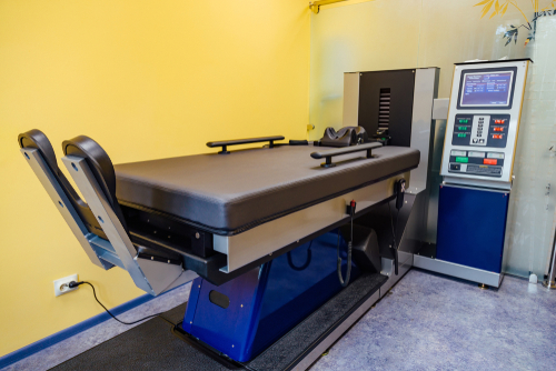 Spinal decompression table used for non-surgical back pain treatment