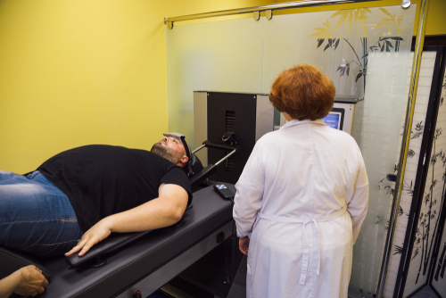 Man receiving spinal decompression treatment for back pain