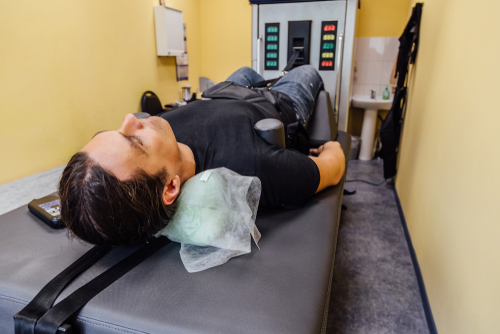 Man undergoing spinal decompression therapy for chronic back pain relief