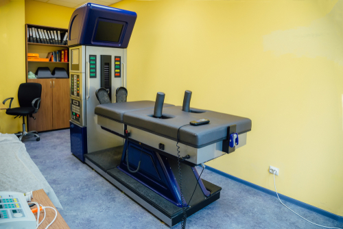 Spinal decompression therapy table used in chiropractic treatment
