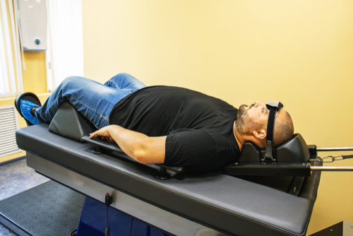 Man with back pain receiving spinal decompression therapy in Mandarin, Jacksonville, FL